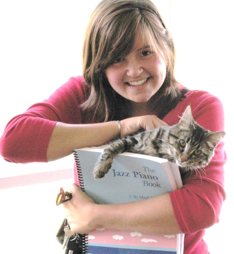 All my students love and enjoy my cats.  Holding "The Jazz Piano Book," this iconic jazz text, this young lady thoroughly enjoyed taking piano under me,, as I enjoy nearly all of my students.
